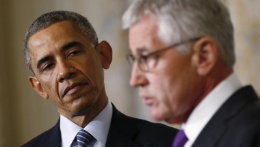 U.S.  President Obama listens to Defense Secretary Chuck Hagel after the president announced Hagel's resignation at the White House in Washington