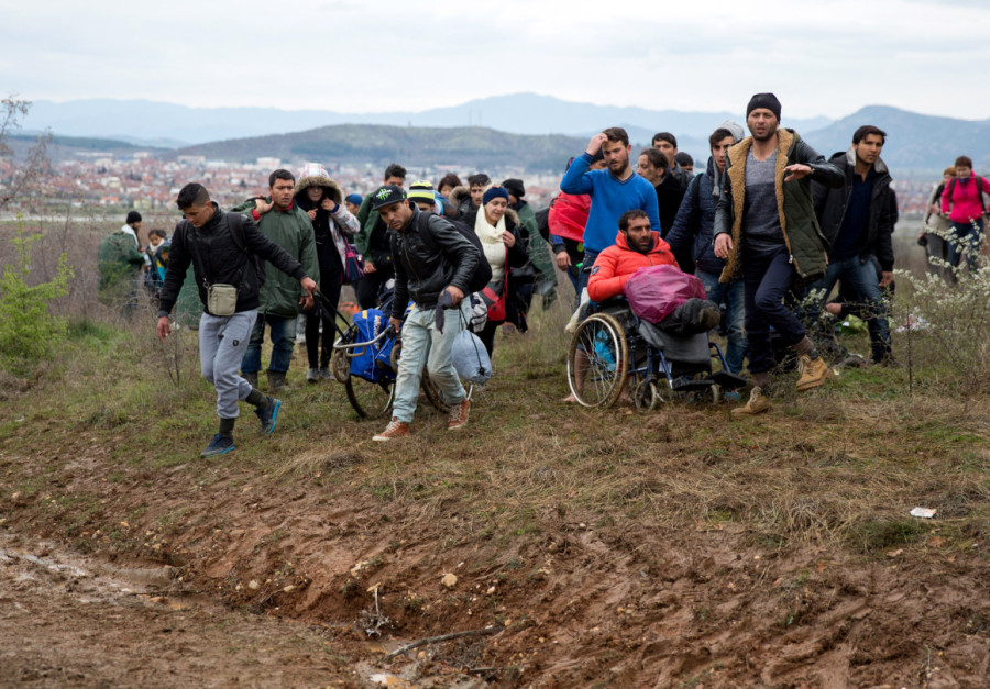 Frustrated Migrants Stranded On The Border Attempt To Walk In To Macedonia
